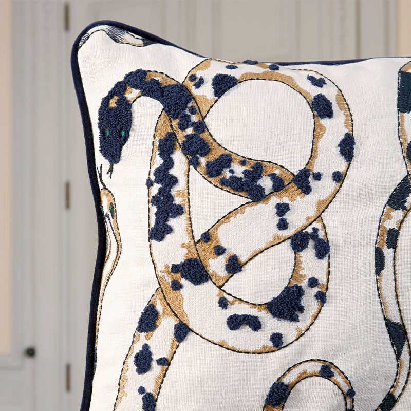 Cushion with orobouros embroidered pattern designed by Victoria Maria Geyer for Pierre Frey